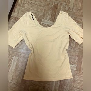 This is a yellow mid sleeve shirt very nice for spring .